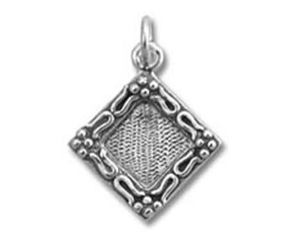 Ornate silver diamond-shaped filigree pendant
