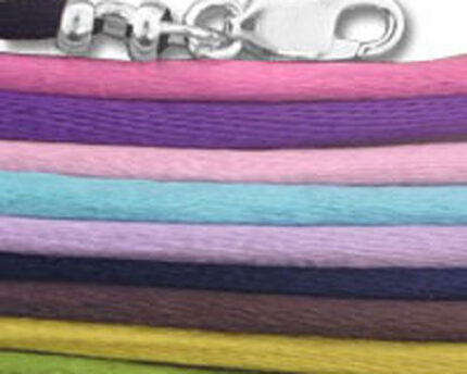 Stacked colorful cord bracelets with silver clasp