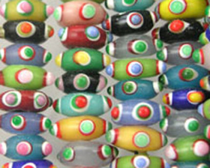 Colorful patterned glass beads arranged in rows