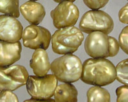 Close-up of golden baroque pearls
