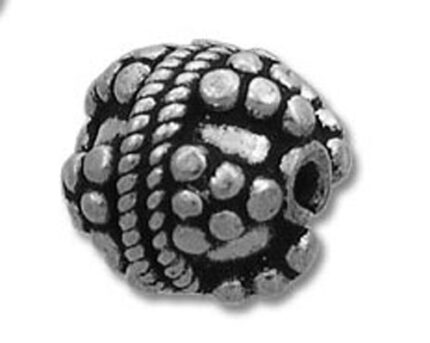 antique silver ornamental bead with dotted pattern