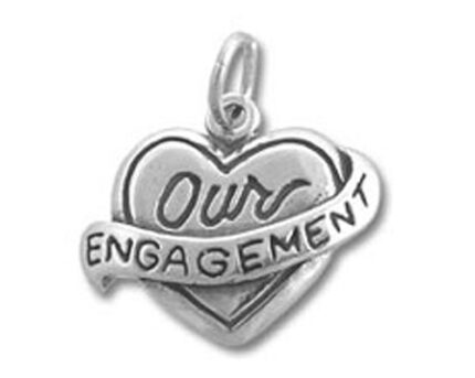 Silver heart pendant engraved "Our Engagement