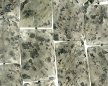 Aerial view of vacant lots and dirt roads