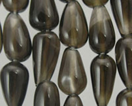 Smoky teardrop glass bead strands close-up