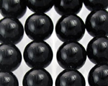 Close-up of black glossy round beads