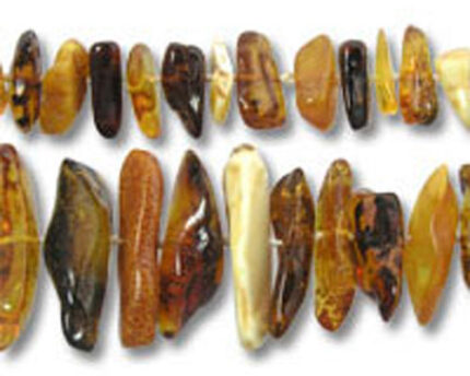 Close-up of polished amber bead necklace
