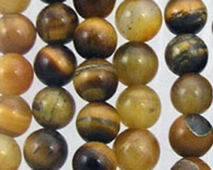 Strands of round tiger's-eye gemstone beads