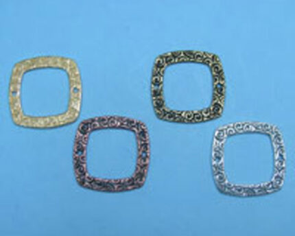 Four ornate square metal frames on blue