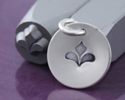 Metal stamping punch with stamped fleur-de-lis