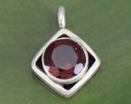 Silver square pendant with round red gemstone