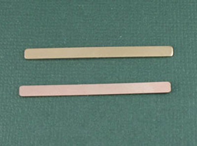 Gold and pink metal bars on green background
