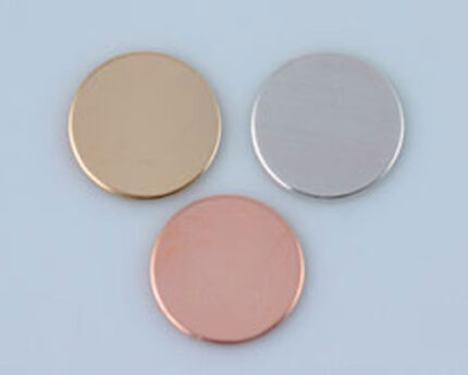 Three metal discs in gold, silver, rose gold