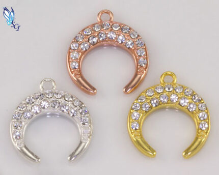 Three rhinestone crescent moon charms