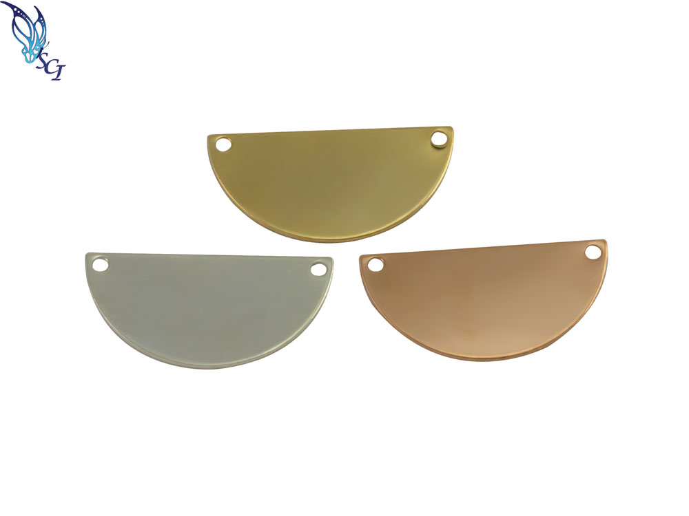 Three semicircular metal pendants with holes Three semicircular metal pendants with holes