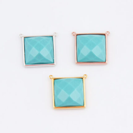Three framed turquoise square gemstone pendants