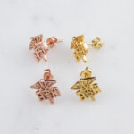 Gold and rose gold star-shaped stud earrings