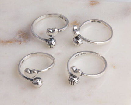 Silver rings with heart and sports ball charms