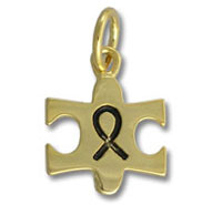 Gold puzzle-piece pendant with black awareness ribbon