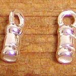Two silver flashlight charms on wooden surface