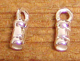 Two silver flashlight charms on wooden surface