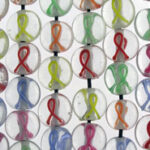 Colorful awareness ribbons in round glass beads