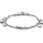 Delicate silver charm bracelet with small pendants