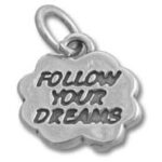 Silver charm engraved "Follow Your Dreams