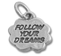 Silver charm engraved "Follow Your Dreams