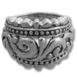 Ornate silver ring with carved scrollwork
