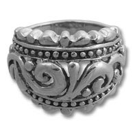 Ornate silver ring with carved scrollwork