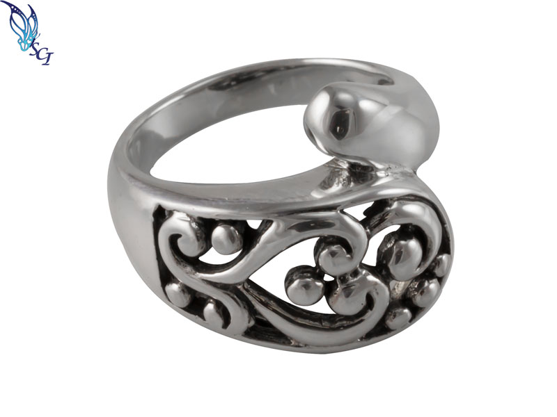 Ornate silver filigree ring with bead accents Ornate silver filigree ring with bead accents