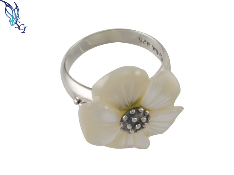 Silver ring with white flower centerpiece Silver ring with white flower centerpiece