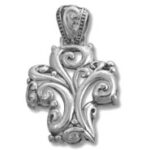 Ornate silver cross pendant with scrollwork