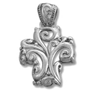 Ornate silver cross pendant with scrollwork