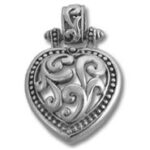 Ornate silver heart locket pendant with scrollwork