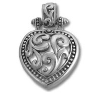 Ornate silver heart locket pendant with scrollwork