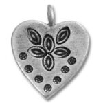 Heart-shaped silver pendant with floral pattern