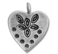 Heart-shaped silver pendant with floral pattern