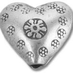 Silver heart-shaped bead with floral motifs