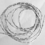Coiled silver wire forming overlapping loops