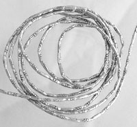 Coiled silver wire forming overlapping loops
