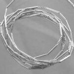 Stack of textured silver bangles