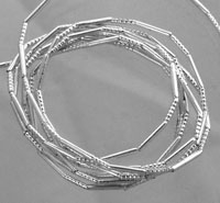 Stack of textured silver bangles