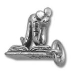 Silver kneeling person reading book charm