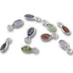 Assorted oval gemstone charms with silver settings
