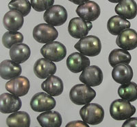 Strands of dark iridescent pearls