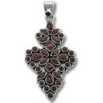 silver pendant with red gemstone cluster