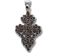 silver pendant with red gemstone cluster