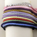 Stack of colorful twisted cord bracelets
