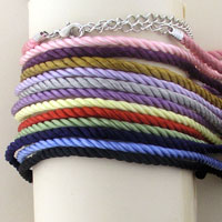 Stack of colorful twisted cord bracelets